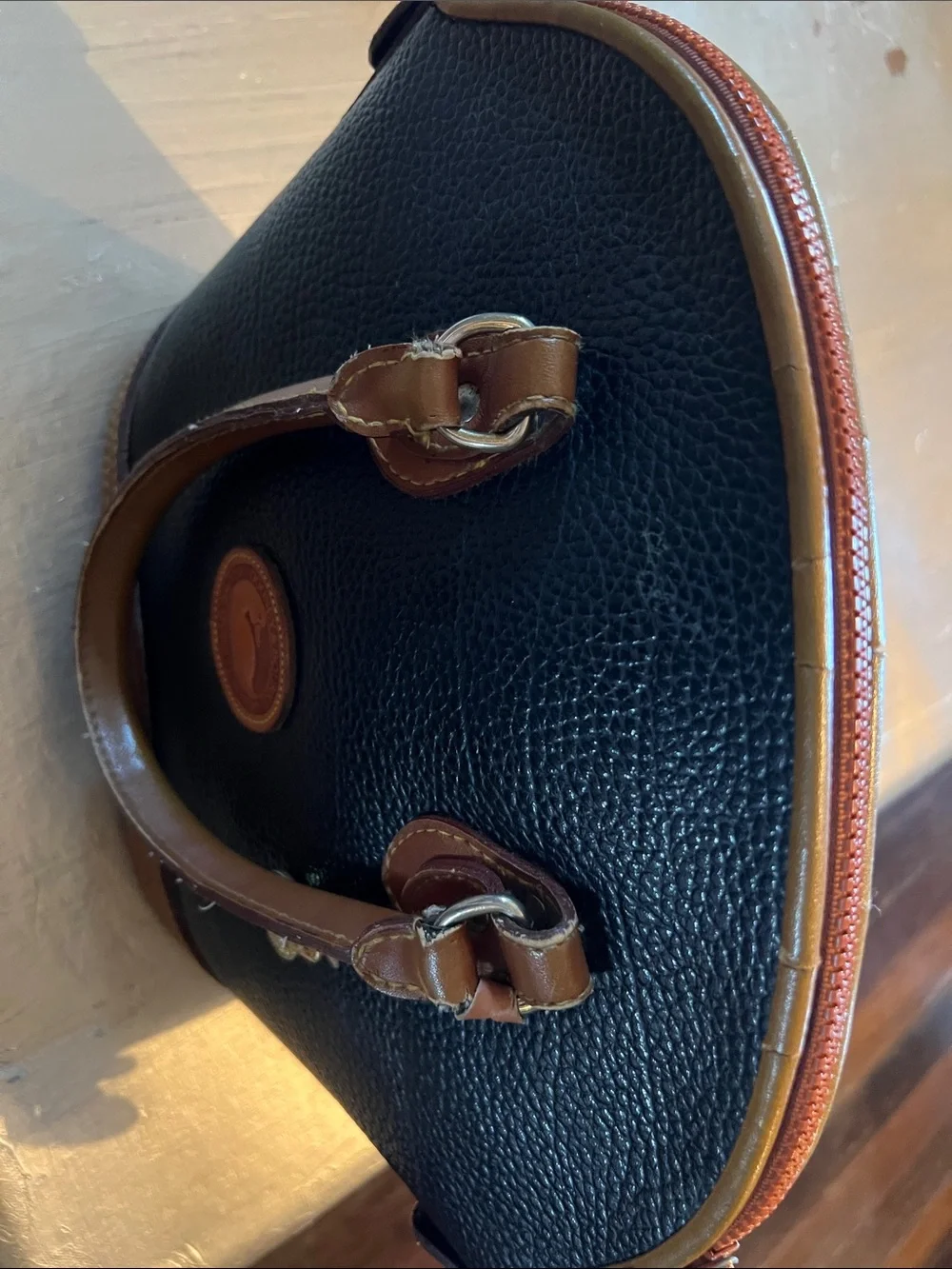 Dooney & Bourke Black Pebbled Leather Satchel with Brown Trim and Handles